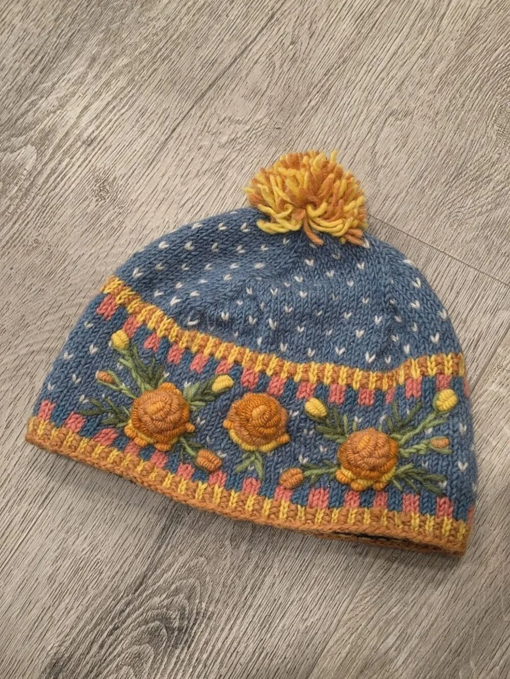 Lost Horizons Hand-Knit Wool Beanie With Floral Embroidery & Pom